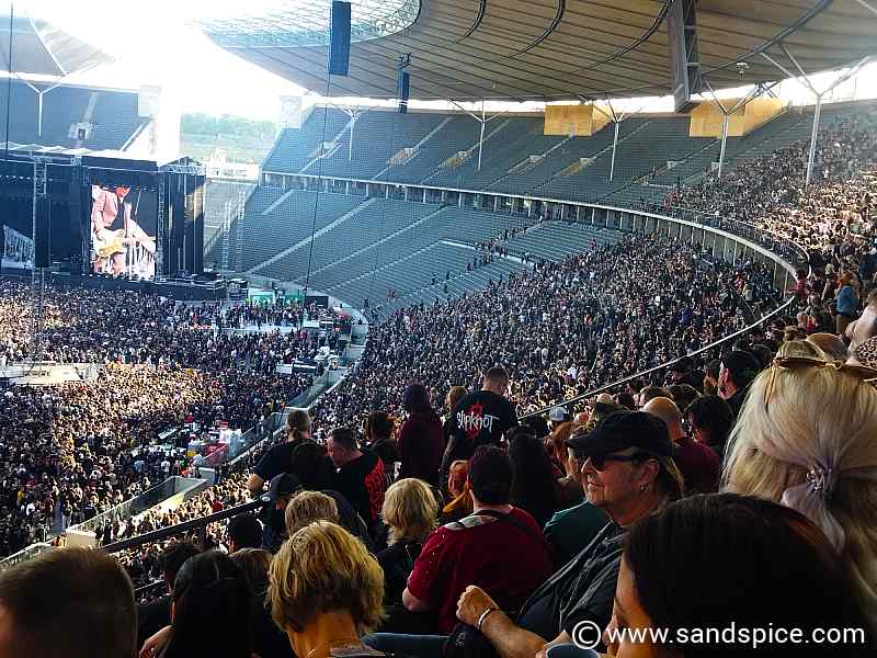 View from the tiered seating stalls overlooking a crowded Berlin Olympiastadion during the System of a Down rock concert.